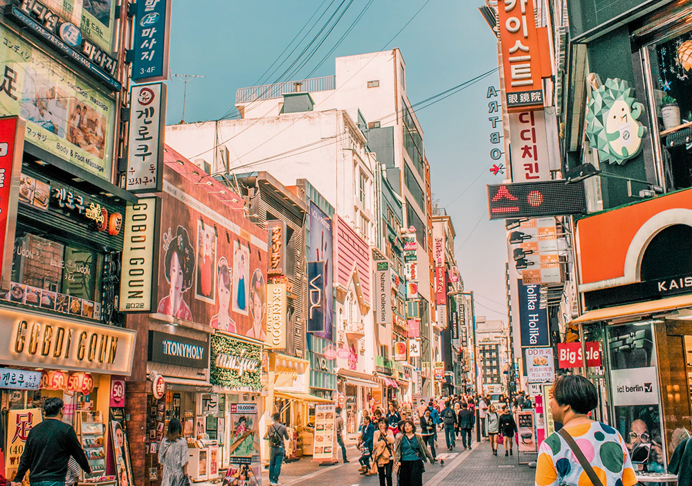Street view of South Korean city with people walking