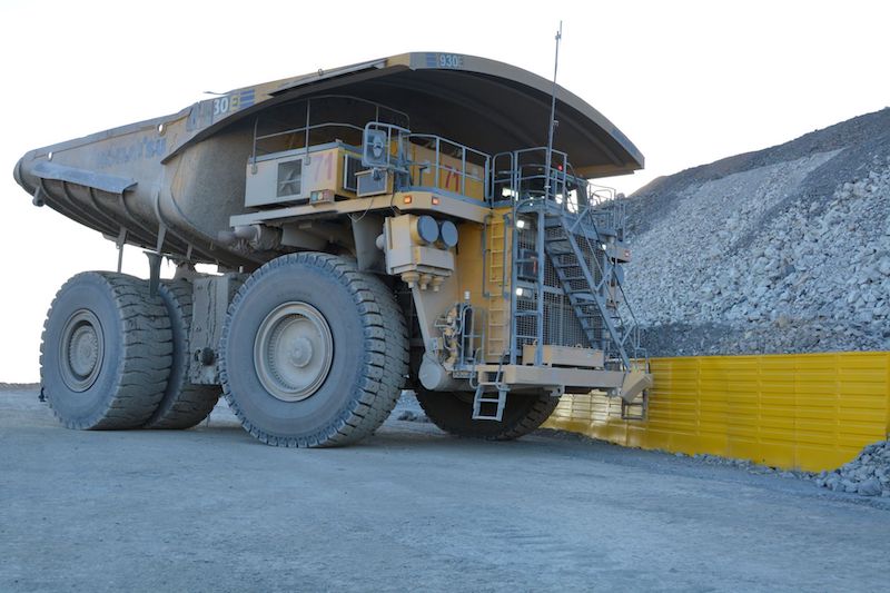 Image of mining vehicle parked next to Safescape's Edge Protector product 