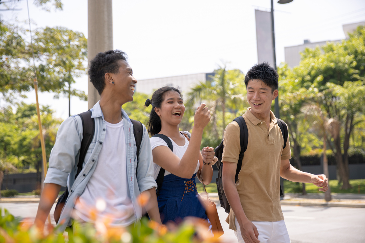 Multi-Ethnic Asian friends walking in city street, Bonifacio Global City, Mania