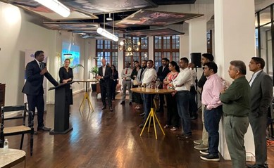 Attendees listen to a speaker at the Victoria Connect networking event 