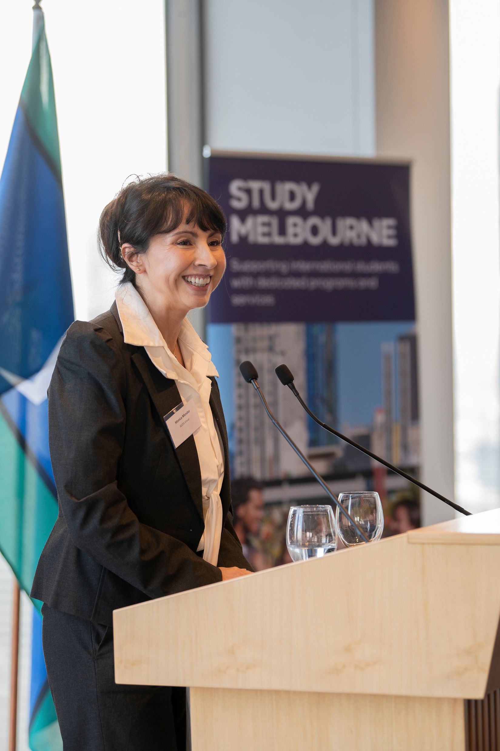 Monica Mendez stands behind the podium, and addresses attendees at GVw's at &lsquo;Building connections with Latin America&rsquo; event 